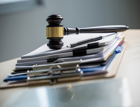Judge and documents on office desk