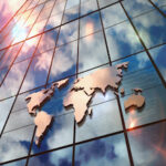 World Map sign on glass skyscraper with mirrored sky illustration