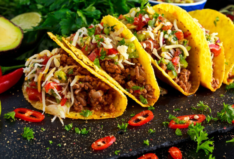 Mexican food - delicious taco shells with ground beef and home made salsa