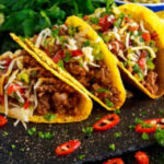 Mexican food - delicious taco shells with ground beef and home made salsa