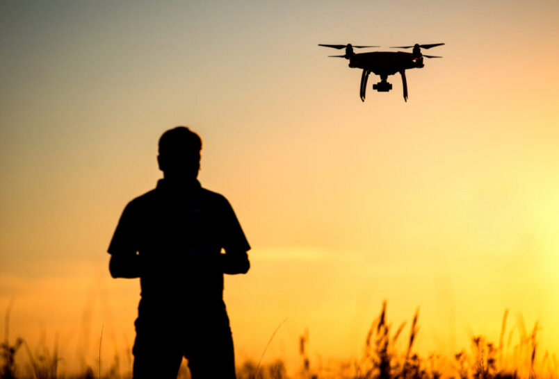 Drone Laws, flying drone over field