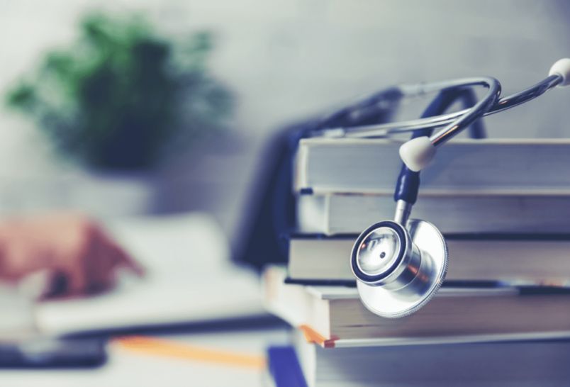 stethoscope on stack of books