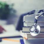 stethoscope on stack of books