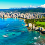 Aerial View of Blue Water, Cityscape and Coastline in Hawaii.