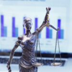 lady justice in front of a bar graph